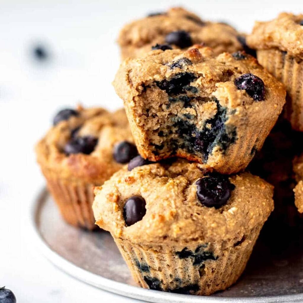 Healthy protein powder muffins packed with blueberries, showcasing a delicious and nutritious option for protein powder recipes.